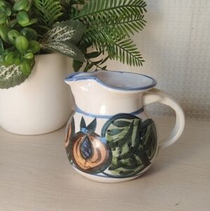 Handcrafted Ceramic Creamer with Fruit and Leaf Design